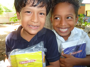 Two children with notebooks from SchoolBOX